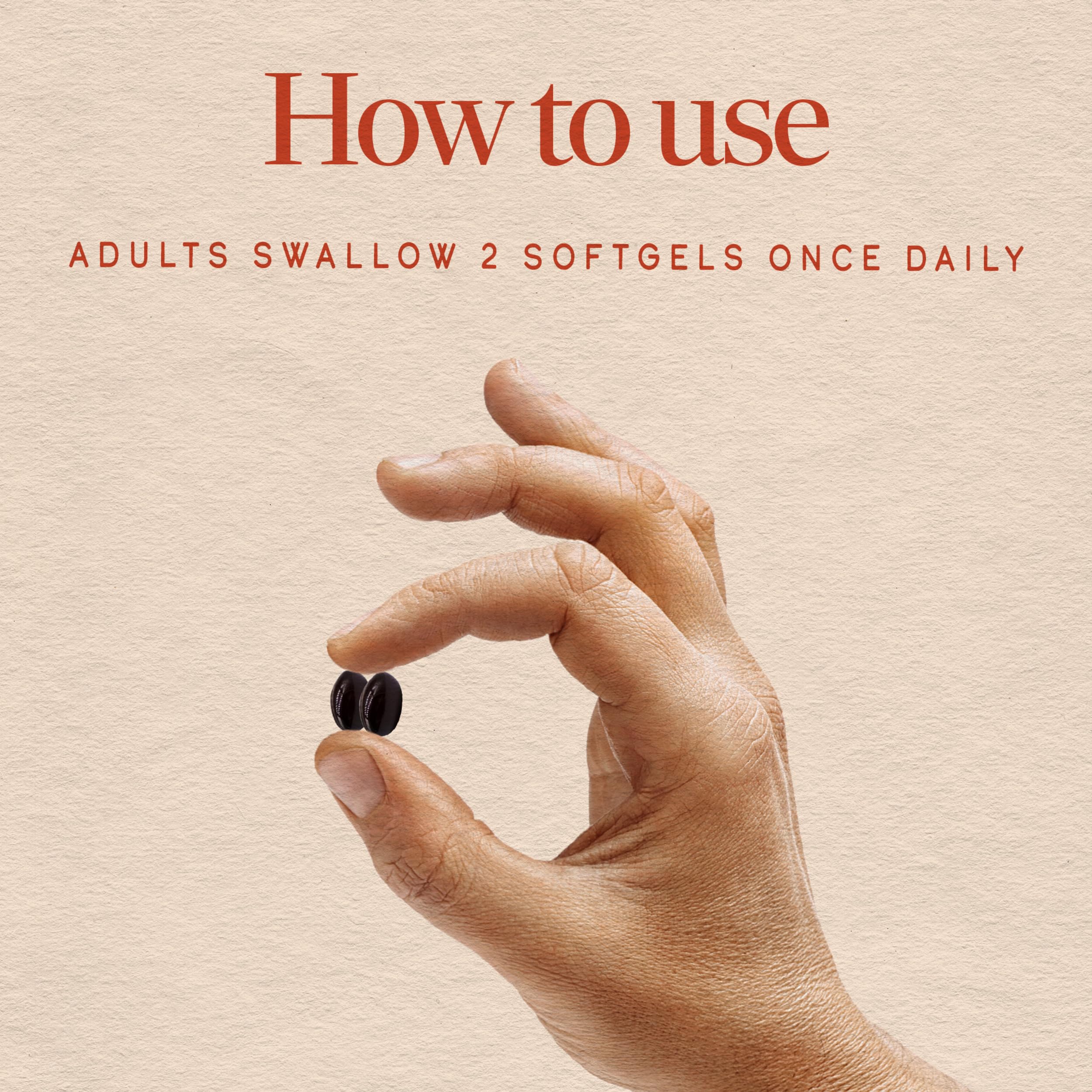 Nature's Way mano sosteniendo una softgel para comparar tamaño y facilidad de tomar