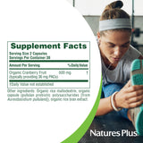 NaturesPlus cápsula en mano indicando dosificación práctica