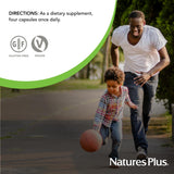 NaturesPlus cápsula junto a moneda para comparar el tamaño real