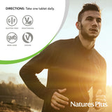 NaturesPlus tableta junto a una moneda para comparar tamaño práctico