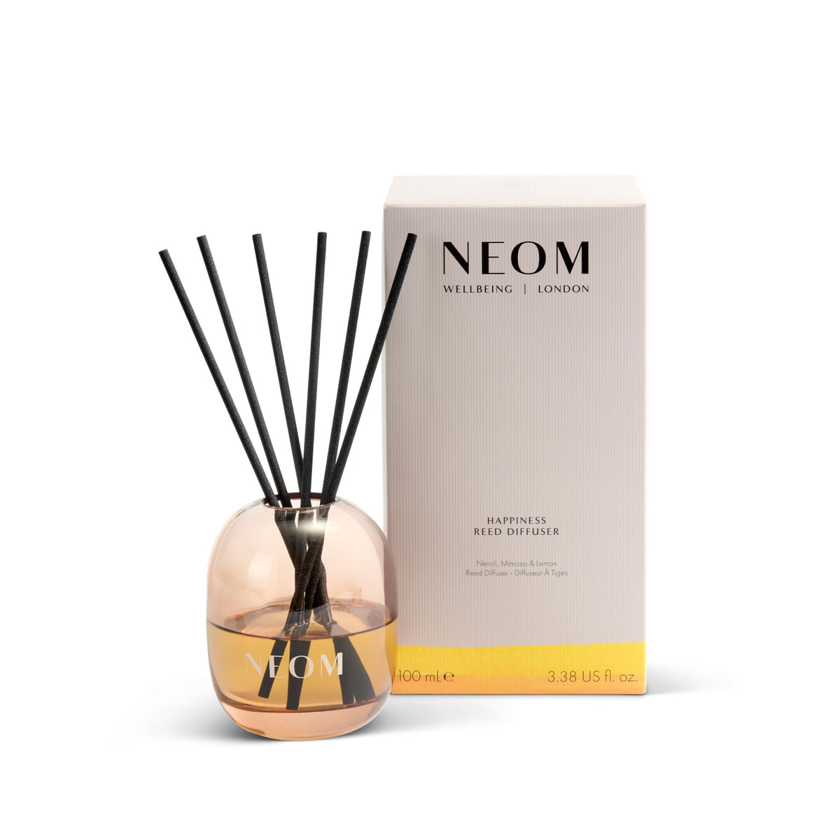NEOM difusor frontal en vidrio ámbar mostrando diseño elegante y beneficio decorativo
