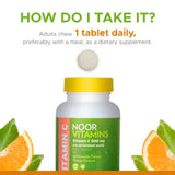 Noor Vitamins envase abierto con 60 tabletas mostrando contenido