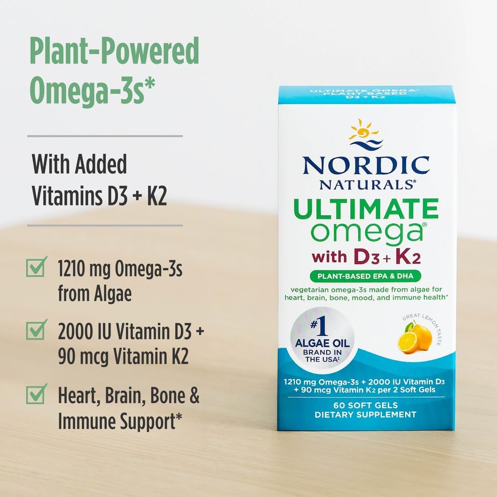 Nordic Naturals cápsulas en mano para comparar tamaño y facilidad