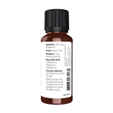 NOW Aceite de Bergamota gota en superficie mostrando textura pura y concentración aromática