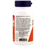 NOW Foods B-2 en contexto de uso diario junto a vaso de agua y reloj
