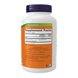 NOW Foods primer plano textural de tabletas de spirulina, muestra consistencia y pureza