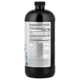 NOW Foods botella MCT junto a una taza para comparar tamaño y porciones