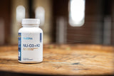 NuEthix Formulations cápsula junto a moneda para comparar escala real