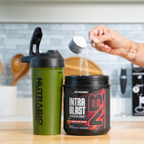 NutraBio bote junto a una regla para comparar tamaño y servicio
