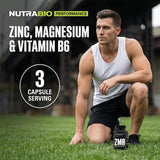 NutraBio ZMA botella junto a objeto para escala visual del tamaño