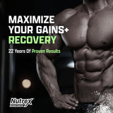Nutrex Research anabol pm bote en gimnasio junto a toalla ilustrando uso post-entreno