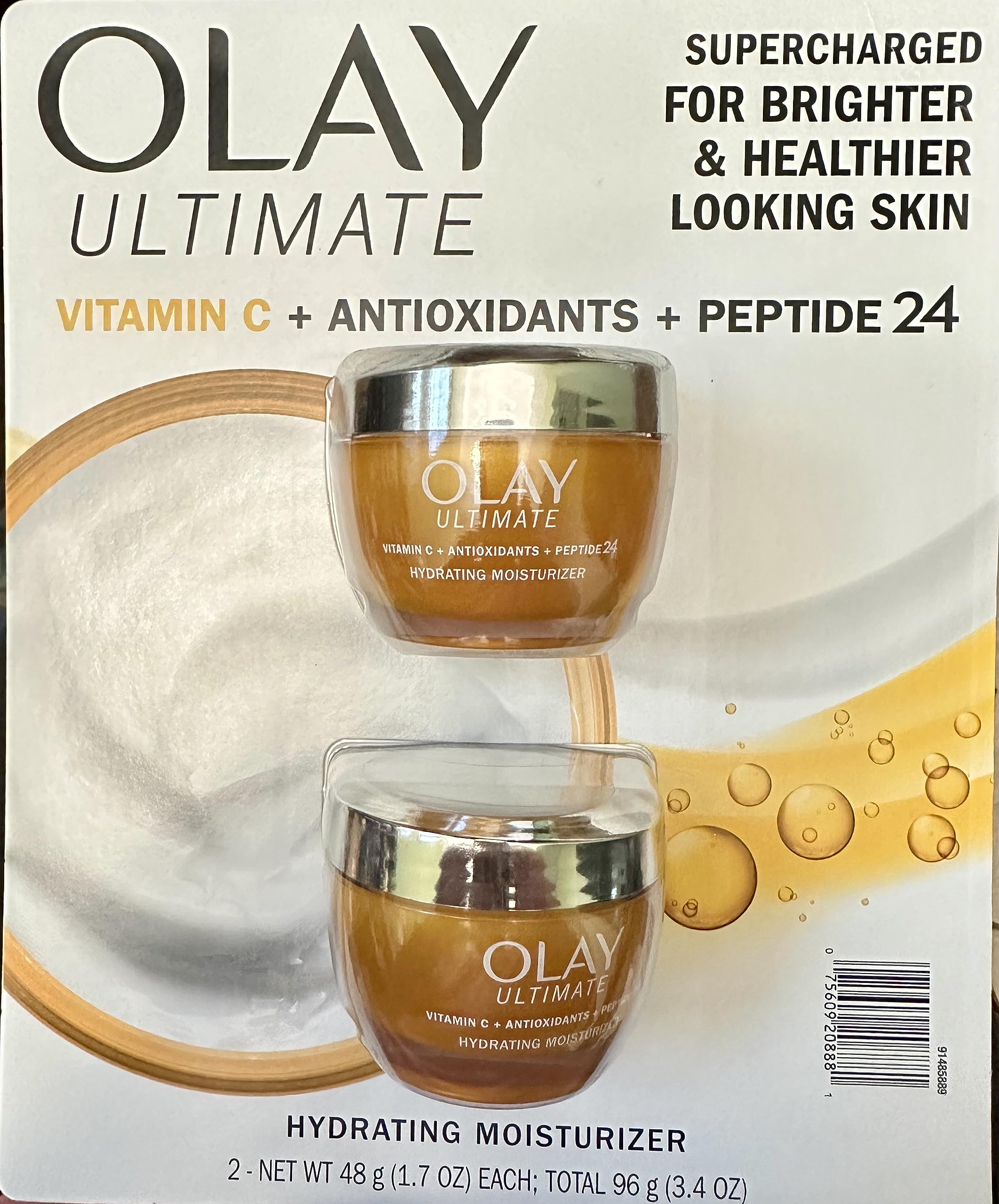 Olay pack frontal mostrando dos frascos para brillo y protección antioxidante