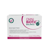 OMNi BiOTiC sobre abierto con polvo, demostrando dosis precisa y portátil