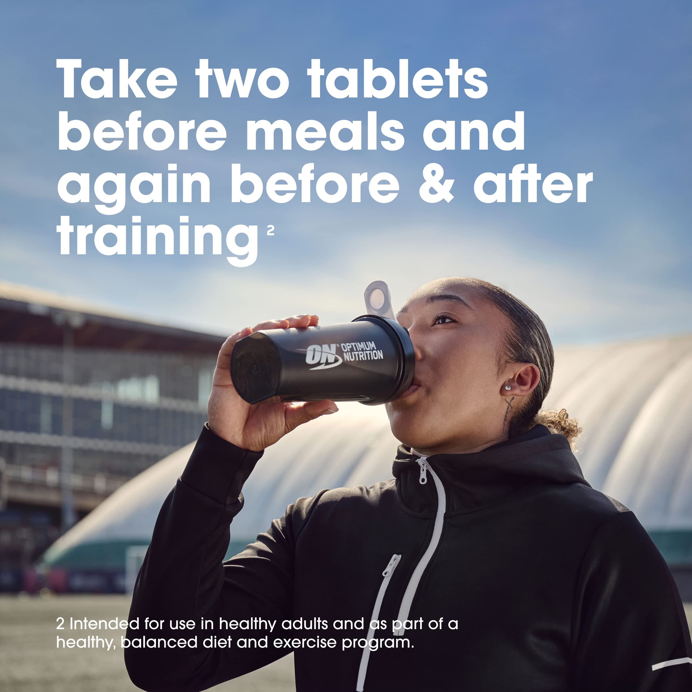 botella Optimum Nutrition abierta con cápsulas visibles para control de stock rápido