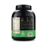 Optimum Nutrition tarro junto a una mano para comparar tamaño real y planificación de porciones.