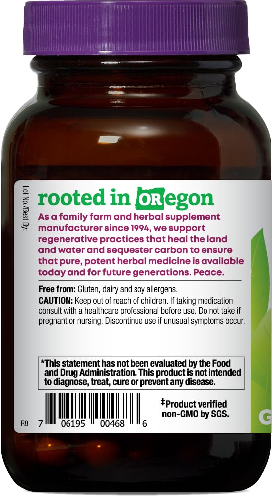 Oregon's Wild Harvest cápsulas en mano para comparar tamaño y dosificación