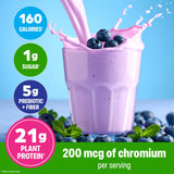 Orgain batido vainilla servido en vaso cremoso listo para beber