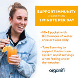Organifi Immunity comparación tamaño sobre junto a mano, porción portátil