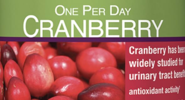 Pacran Cranberry cápsulas colocadas en organizador semanal, mantiene la rutina organizada