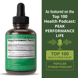 Peak Performance frasco en mano para comparar tamaño y control de dosis