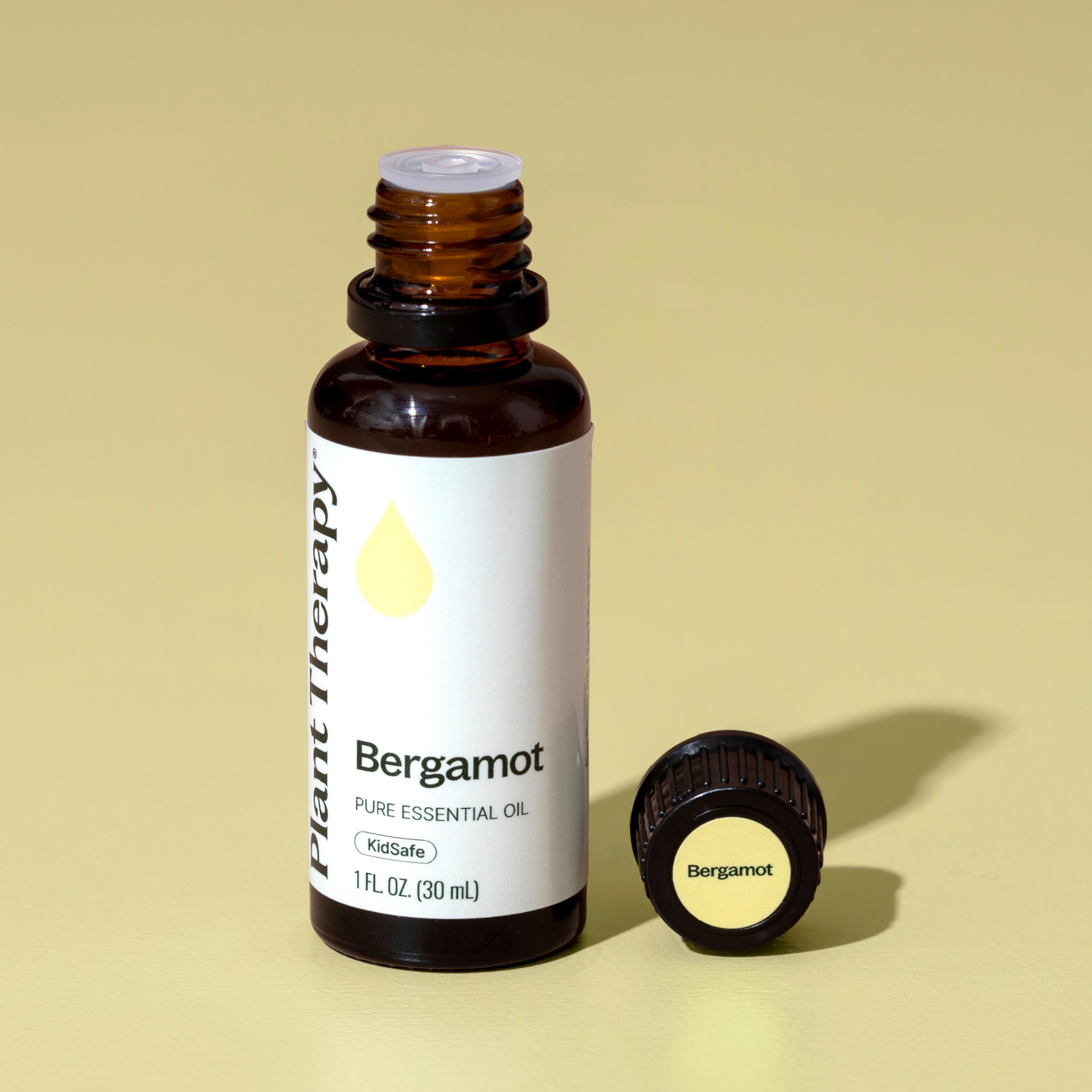 Plant Therapy frasco de 30 mL junto a una regla para comparar tamaño