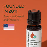 Plant Therapy frasco 10 ml junto a una moneda para comparar tamaño