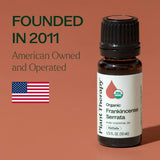 Plant Therapy botella de 10 ml junto a moneda para comparar tamaño
