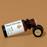 Plant Therapy mirra junto a otros objetos para comparar tamaño 10 ml