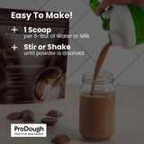 ProDough envase junto a una manzana para comparar tamaño y porciones