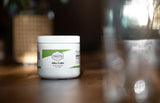PROFESSIONAL COMPLEMENTARY HEALTH FORMULAS Alka Calm envase junto a objetos para comparar tamaño y porciones
