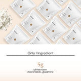Cucharada medidora con 5 g de ProMix Nutrition L‑glutamina lista para dosificar