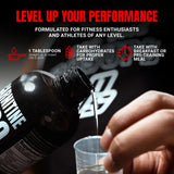 ProSupps L-Carnitine Liquid comparación de tamaño con una mano para escala visual