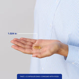 Pure Encapsulations cápsulas en mano para apreciar tamaño y dosificación cómoda