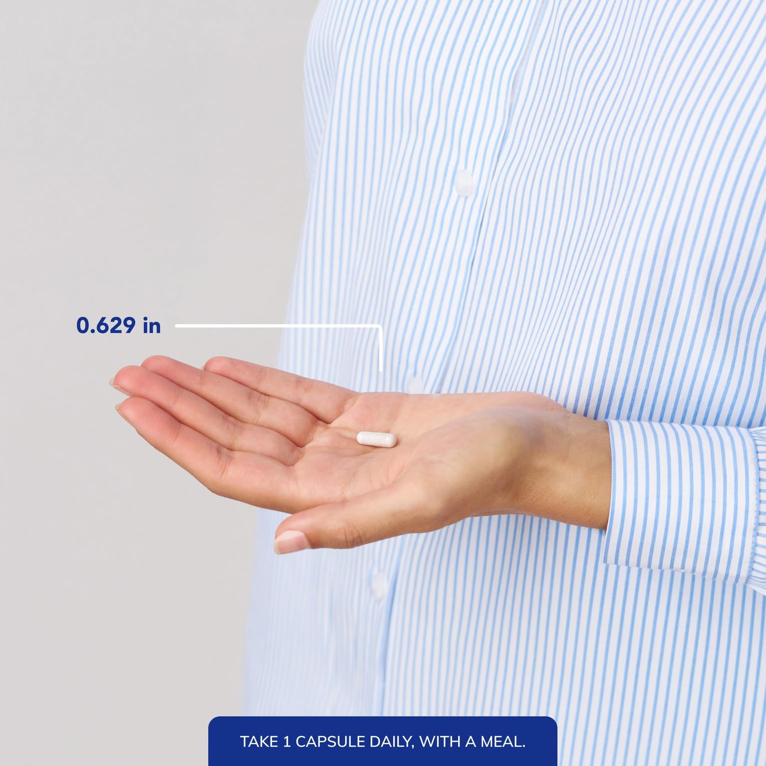 Pure Encapsulations frasco junto a una regla para mostrar tamaño y capacidad
