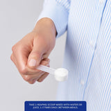 Cuchara medidora junto a envase Pure Encapsulations para dosificación precisa
