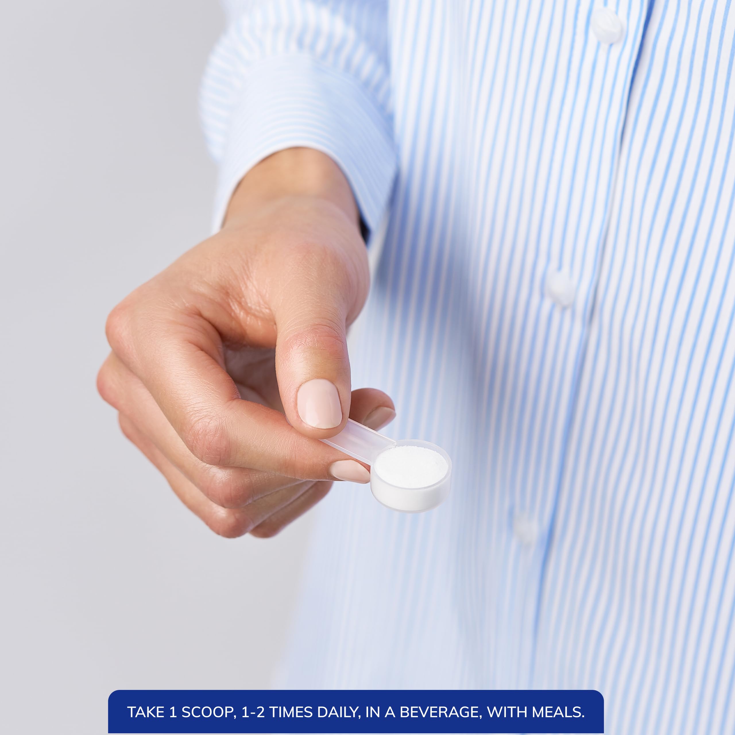 Cucharilla medidora junto a bote Pure Encapsulations para dosificación precisa