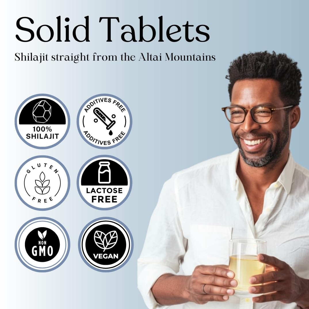Pure Himalayan Shilajit tableta en mano para comparar tamaño y conveniencia