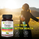 Pure Nutrition Papaya Complete cápsulas junto a un vaso de agua para uso práctico después de comidas