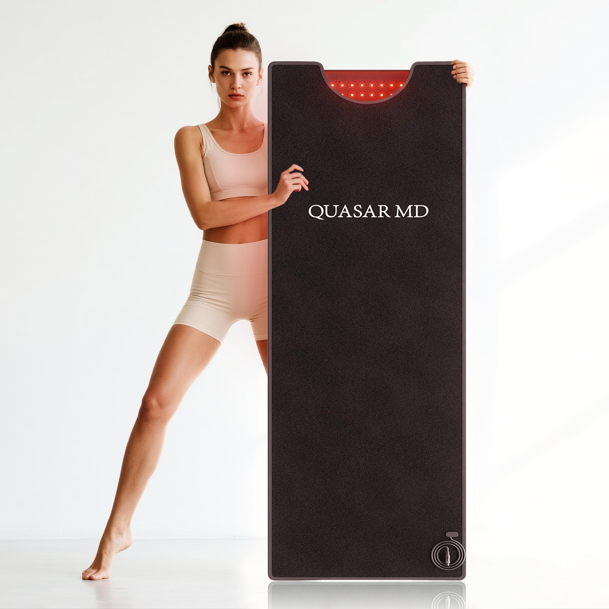 QuasarMD persona usando la esterilla durante yoga para mejor recuperación post-ejercicio
