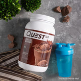 Quest etiqueta nutricional destacando 22 g proteína y <1 g azúcar