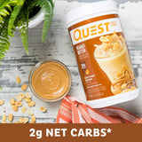 Batido preparado con Quest Peanut Butter en vaso, alto en proteína