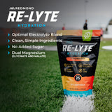 REDMOND Re‑Lyte en uso con deportista hidratándose y recuperación eficiente