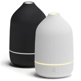 Salubrito difusor pack frontal blanco y negro, aspecto minimalista y compacto