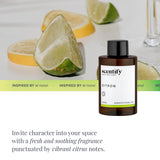 Botella Scentify Citron 100 ml junto a objetos cotidianos para mostrar tamaño práctico