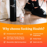 Seeking Health pastilla cerca de boca sugiriendo fácil administración
