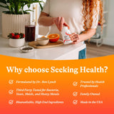 Seeking Health cápsula junto a moneda para comparar tamaño y dosis práctica