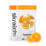 Skratch Labs frente del envase naranja mostrando el diseño y porciones