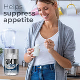 Slim-Tox cápsulas junto a una mano para comparar tamaño y facilitar ingesta