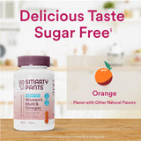 SmartyPants gomitas junto a frutas para sugerir sabor natural naranja