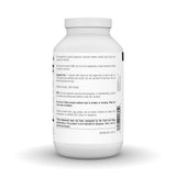 Source Naturals cápsulas junto a plato para ilustrar uso con comidas